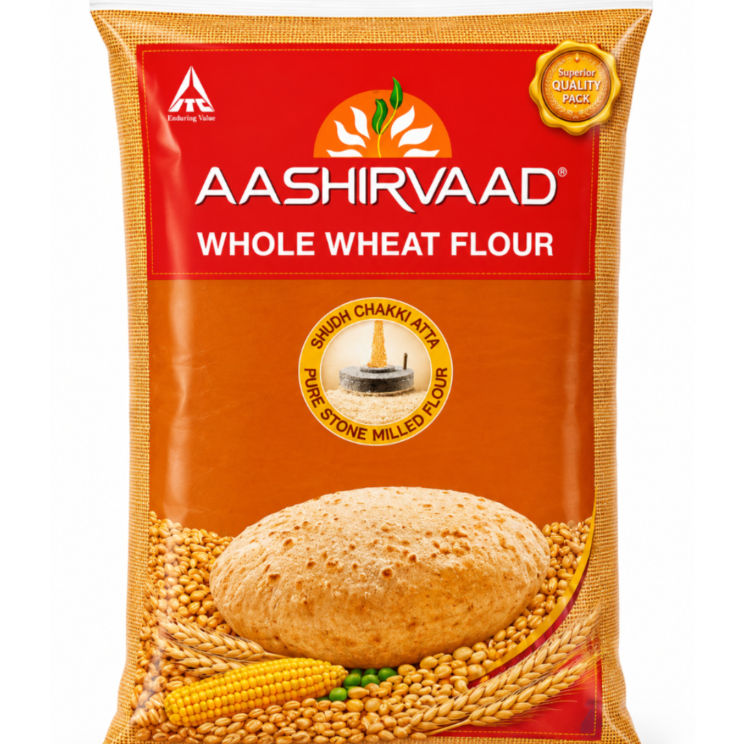 Aashirvaad Whole Wheat Flour in a 1 kg bag. The packaging features a bright red top section with the brand name in white, a golden-brown lower section, and an illustration of a whole wheat loaf surrounded by wheat, soybeans, and corn.