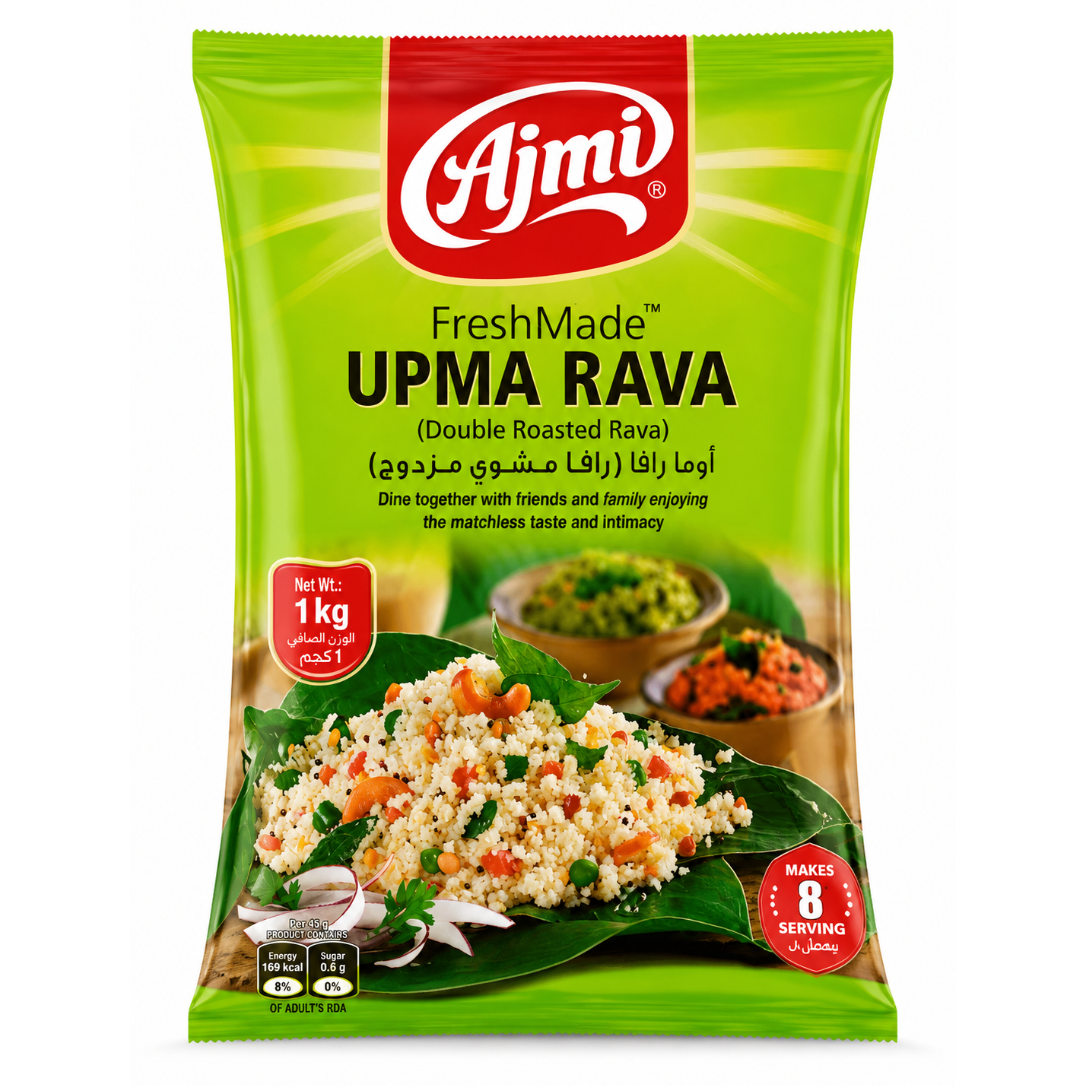 A 1 kg bag of Ajmi FreshMade UPMA RAVA (Double Roasted Rava) on a white background. The packaging is bright green with a red Ajmi logo at the top, featuring a photo of the prepared UPMA rava dish on a leaf at the bottom.