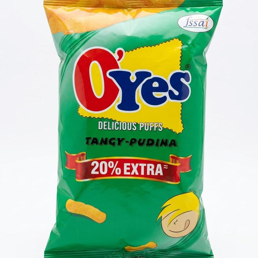 A bag of O'Yes Tangy-Pudina Delicious Puffs on a white background. The packaging is primarily green with a yellow graphic shape behind the red and blue O'Yes logo, and a red banner indicating 20% extra.