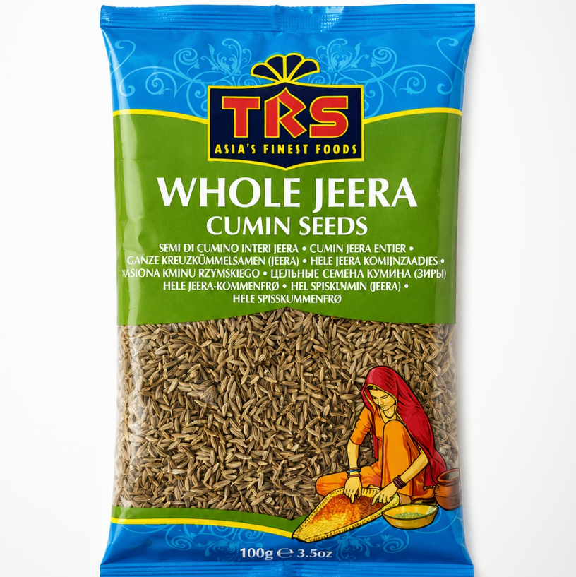A 100g bag of TKS Whole Jeera Cumin Seeds on a plain white background. The packaging features a blue top section with the TKS logo, a green middle section with product text, and a clear window showing the brown cumin seeds inside.