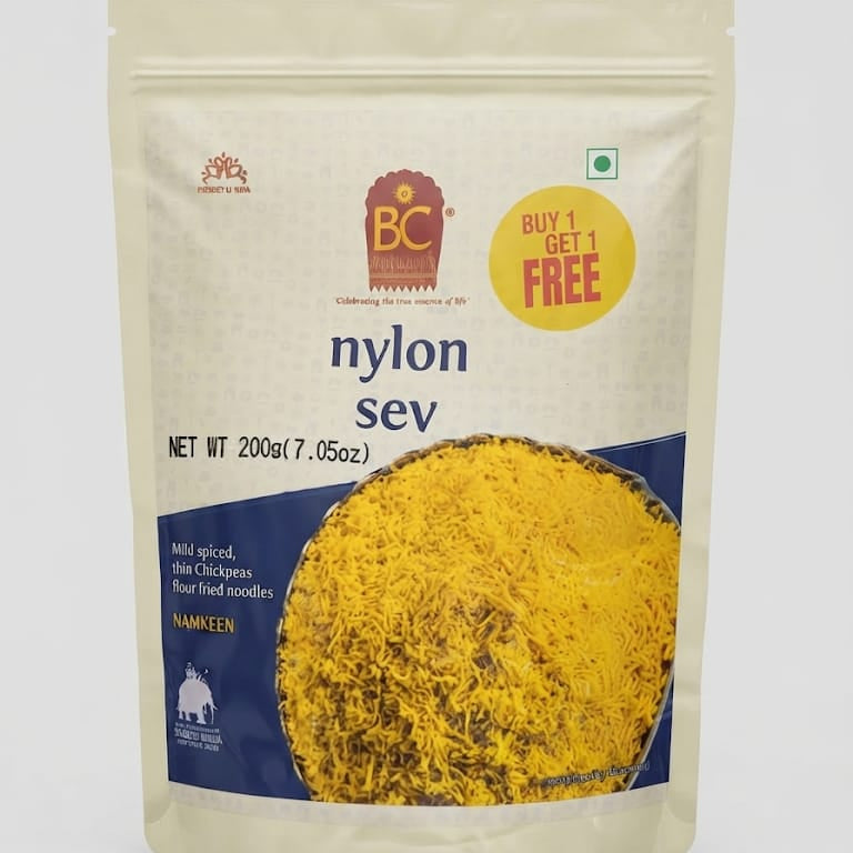 A 200g stand-up pouch of BC Namkeen Nylon Sev (spicy fried thread noodles) on a light gray background. The packaging is cream-colored with a large photo of the yellow noodles on the front, a blue lower section, and a yellow 'BUY 1 GET 1 FREE' promotional sticker.