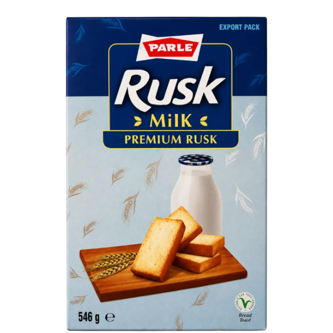 A box of Parle Rusk Milk Premium Rusk bread, featuring a light blue and navy blue design with an illustration of sliced golden-brown bread on a wooden board next to a milk bottle.