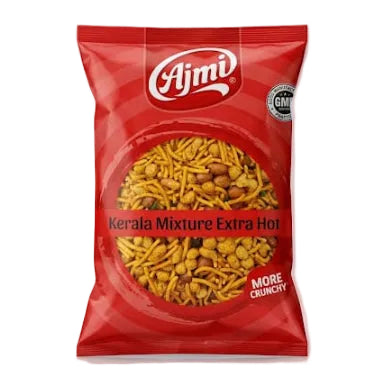 A red bag of Ajmi Kerala Mixture Extra Hot snack chips, showing the yellow-orange fried mixture through a clear window on the front, set against a light gray background.