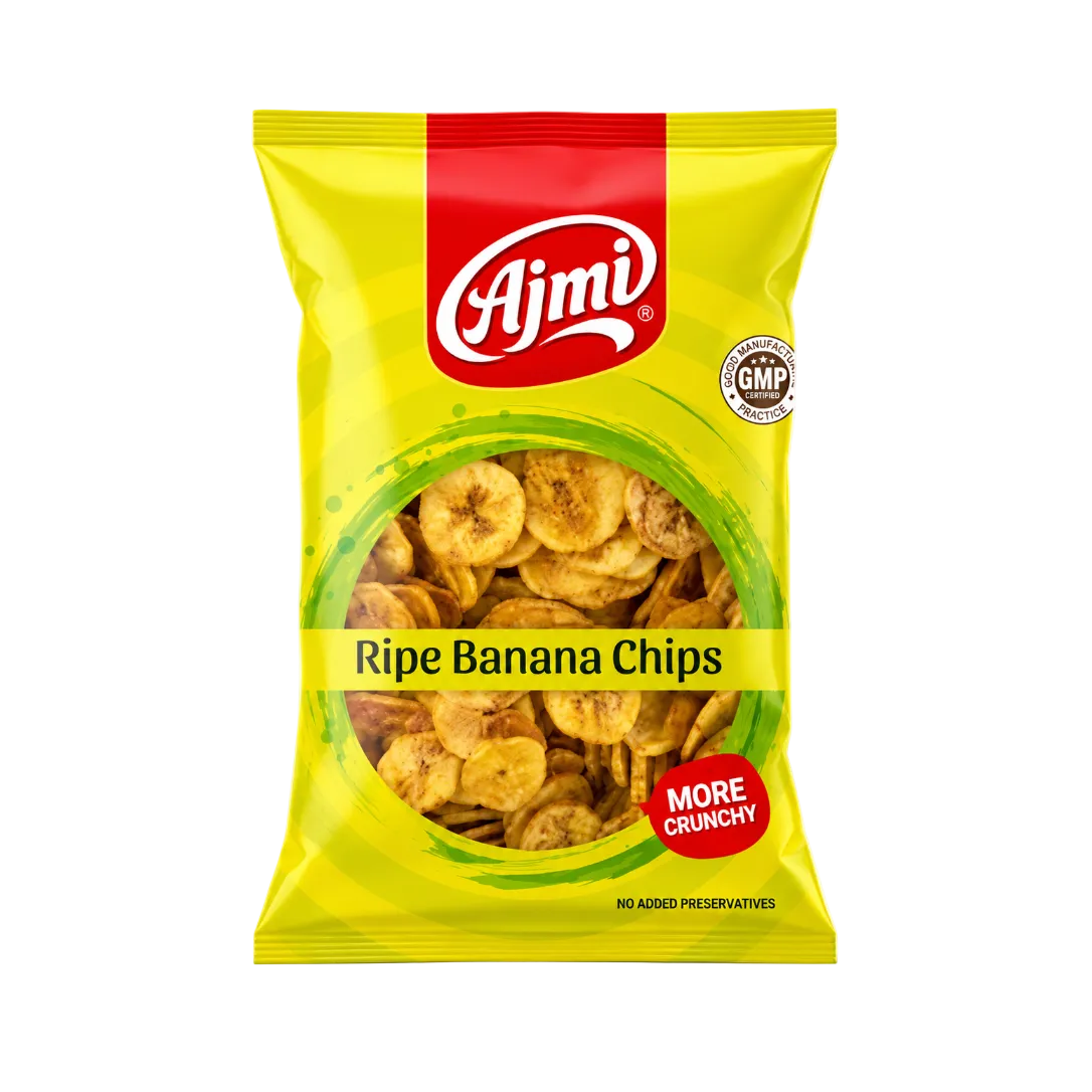 A bag of Ajmi Ripe Banana Chips on a plain white background. The packaging is bright yellow with a red brand logo block at the top, a circular clear window showing the banana chips inside, and red and black text labels.