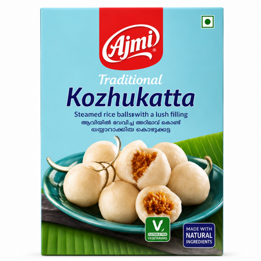 Ajmi Traditional Kozhukatta packaged food product box on a white background, featuring a light blue background, red Ajmi logo, and a photo of steamed rice balls with brown filling on a plate.