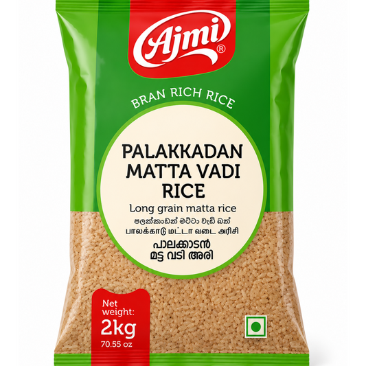 A 2kg bag of Ajmi Palakkadan Matta Vadi Rice, featuring a green and red packaging design with a clear window showing the beige rice grains inside.