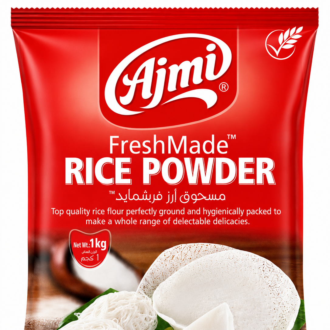 A 1 kg bag of Ajmi FreshMade Rice Powder, featuring a bright red packaging design with white branding and an illustration of white rice grains on a wooden background.