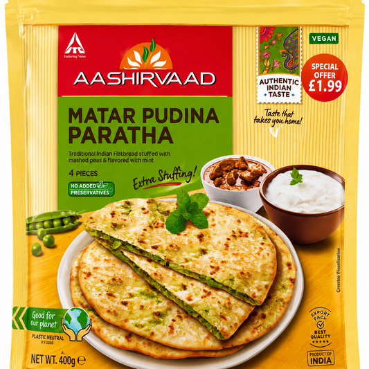 A package of Aashirvaad Matar Pudina Paratha, featuring a yellow and red bag with a photo of stuffed flatbreads on a plate, shown against a plain white background.