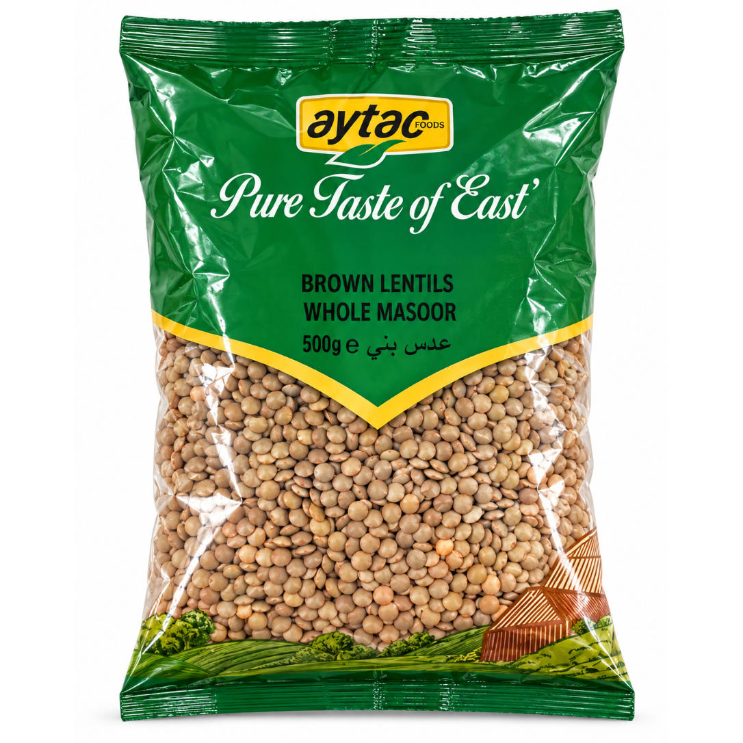 A 500g bag of Aytac Pure Taste of East Brown Lentils Whole Masoor, featuring a green and yellow packaging design with a clear window showing the brown lentils inside, set against a plain white background.