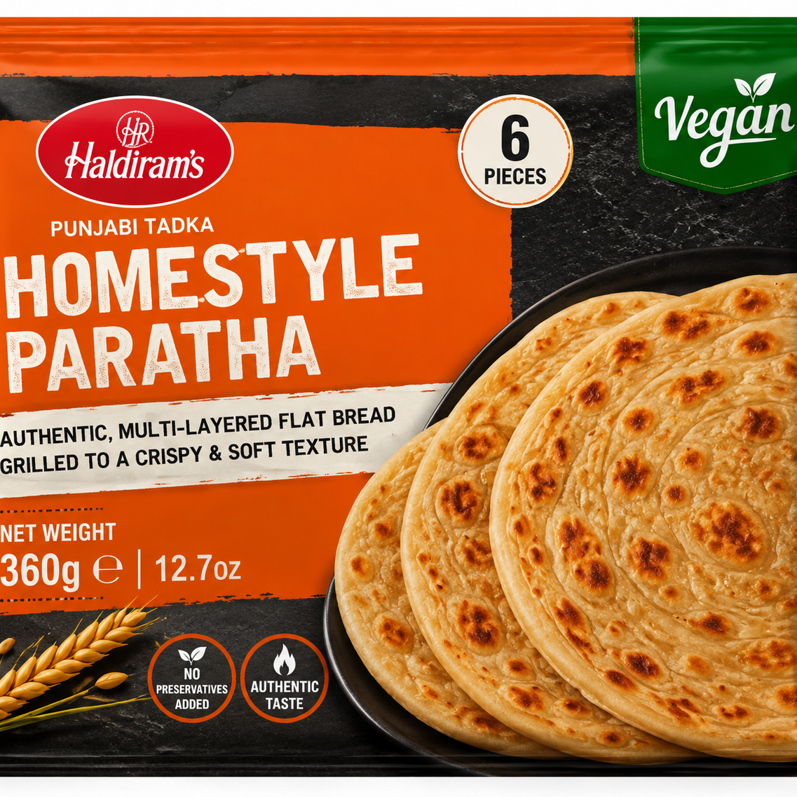 A package of Halidiram's Vegan Homestyle Paratha, featuring a bright orange and black design with a photo of golden-brown cooked flatbreads on the front.