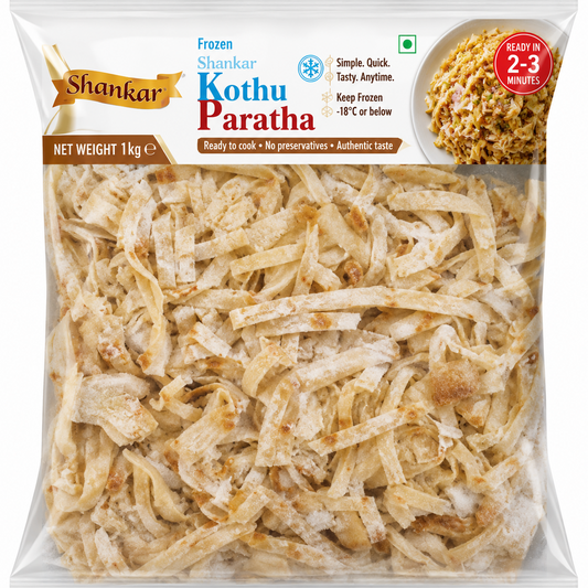Shankar Frozen Kothu Paratha in a 1 kg clear plastic bag, showing the shredded cooked flatbread inside. The packaging features the Shankar brand logo and product details.