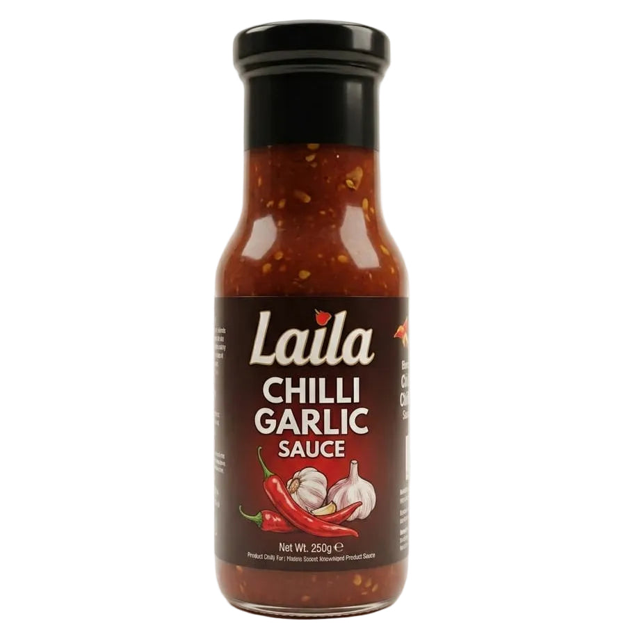 A bottle of Laila Chilli Garlic Sauce on a clean white background. The glass bottle shows the reddish-brown sauce inside, with a black cap and a dark brown label featuring white text and illustrations of red chili peppers and garlic.