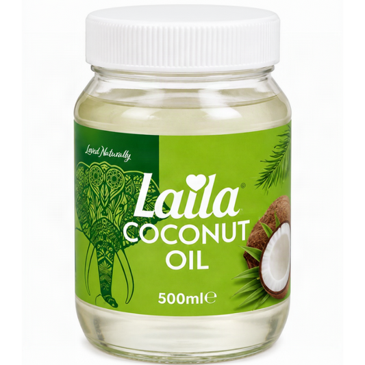 A 500ml glass jar of Laila Coconut Oil with a white ribbed cap and a bright green label featuring an elephant illustration and coconut graphics.