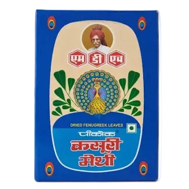 A blue rectangular box of dried fenugreek leaves with a cream-colored central label, featuring a peacock illustration, Hindi text, and the brand name 'Vidalek' in white script.