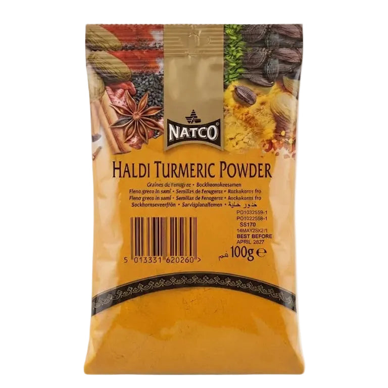 A 100g package of Natco Haldi Turmeric Powder, featuring a golden-yellow color with a decorative top section showing spices and turmeric roots, on a light gray background.