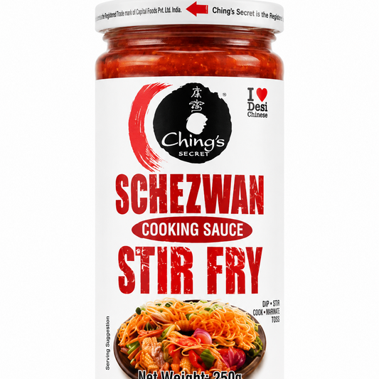 A 250g glass jar of Ching's Secret Schezwan Cooking Sauce Stir Fry, featuring a white label with bold red text and a photo of the prepared sauce in noodles, set against a plain white background.