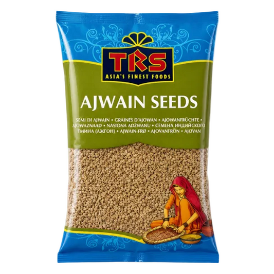 A bag of TKS Ajwain Seeds, featuring a blue and green packaging design with the brand logo and an illustration of a woman grinding the seeds.